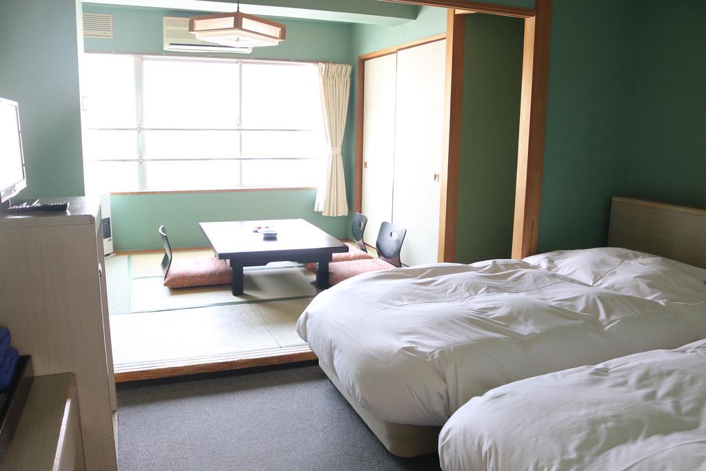 Hotel Sankeien Sapporo Quarto foto